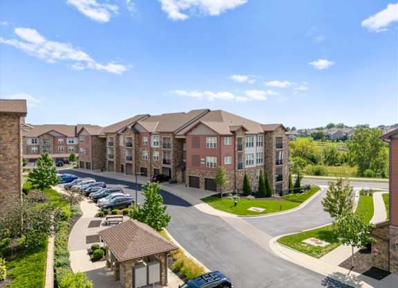 Large apartment complex exterior at The Residences at Bluhawk Apartments, Overland Park, KS