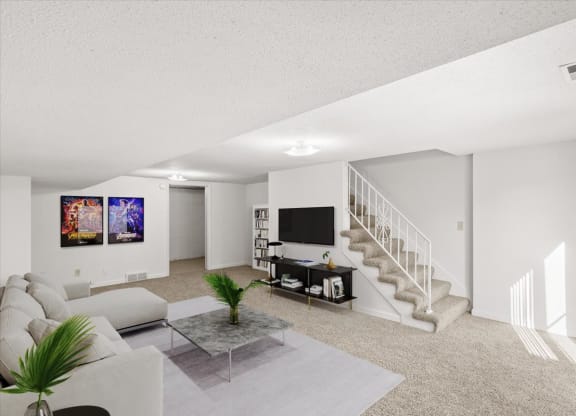 a living room with a couch and a tv