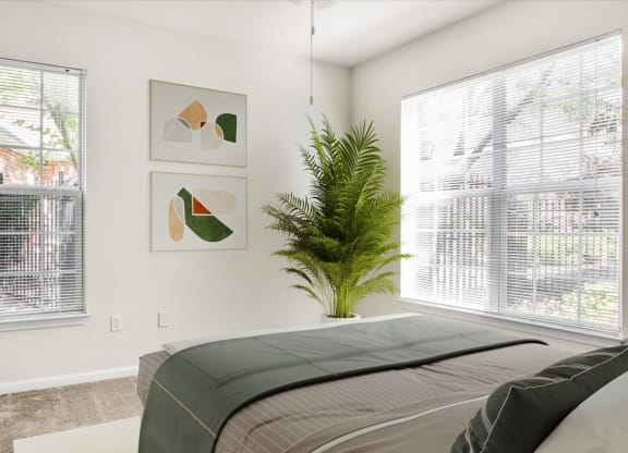 a bedroom with a bed and a potted plant and two windows