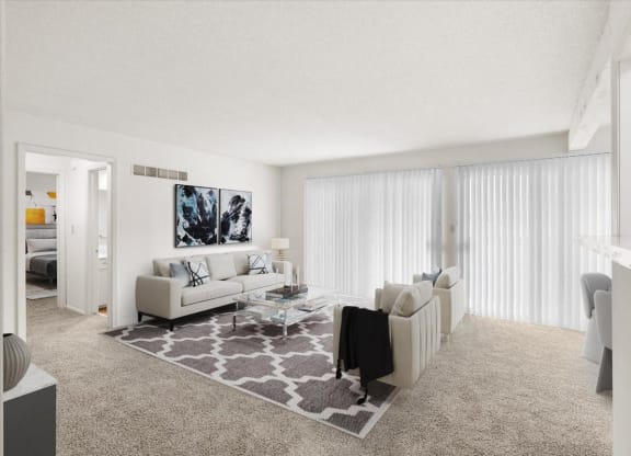A living room with a patio or balcony entrance with sliding glass doors and vertical blinds.