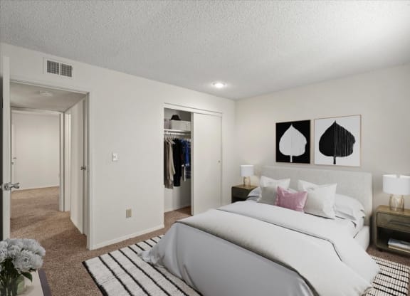 A secondary bedroom with a sliding door closet.
