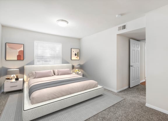 a bedroom with a bed and two night standsat Stonebriar Woods Apartments, Overland Park, Kansas