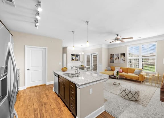 a living room with a kitchen and a couch