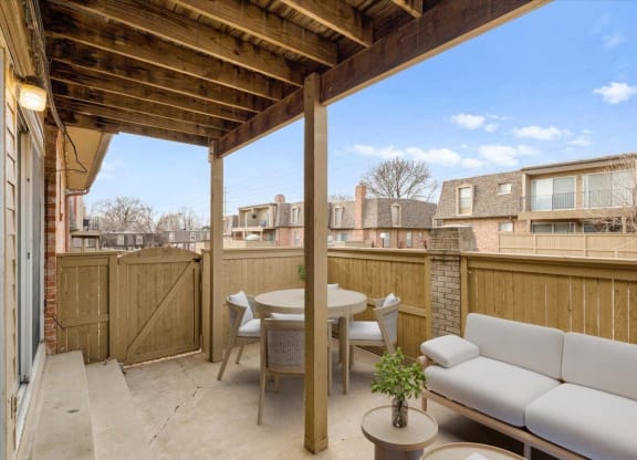 a patio with a couch and a table