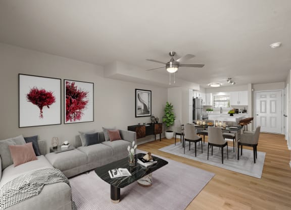 a living room and dining room with a couch and a table