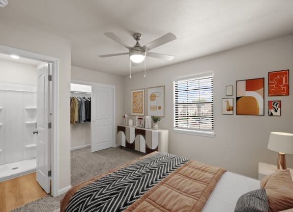 a bedroom with a large bed and a ceiling fan