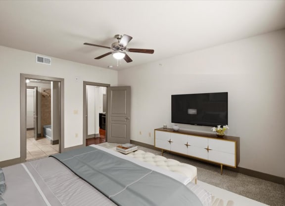 a bedroom with a large bed and a ceiling fan