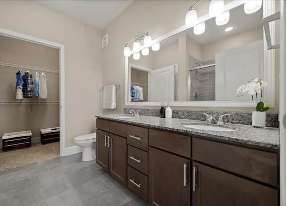 Bathroom with mirror at The Residences at Bluhawk Apartments, Overland Park,