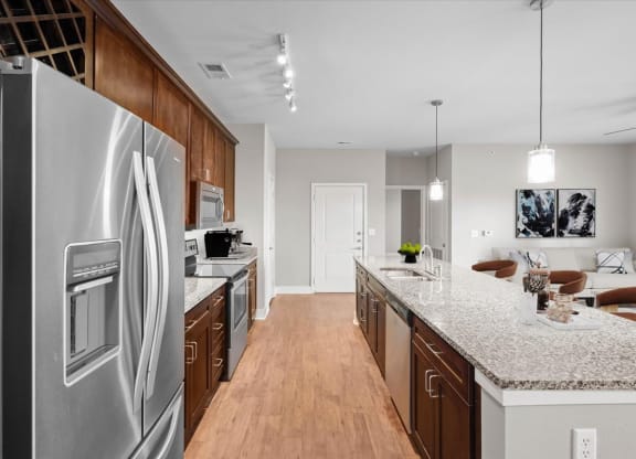 a kitchen with stainless steel appliances and granite counter tops