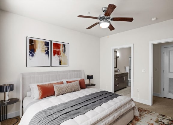 a bedroom with a bed and a ceiling fan