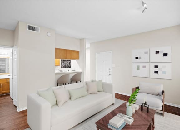 a living room with a couch and a coffee table at Creekview Apartment Homes, Texas, 75254