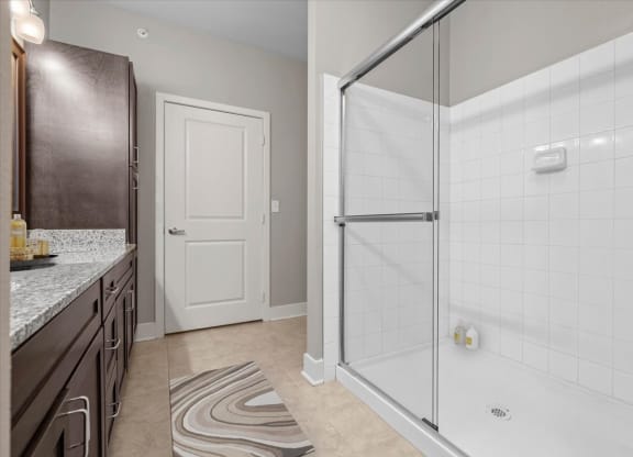a bathroom with a shower and a sink