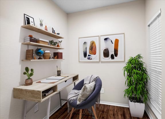 a home office with two paintings on the wall at Creekview Apartment Homes, Dallas