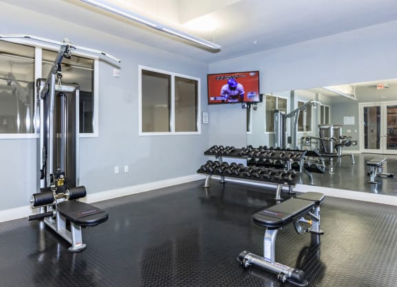 Bench press and weightsat West 39th Street Apartments, Kansas City, 64111