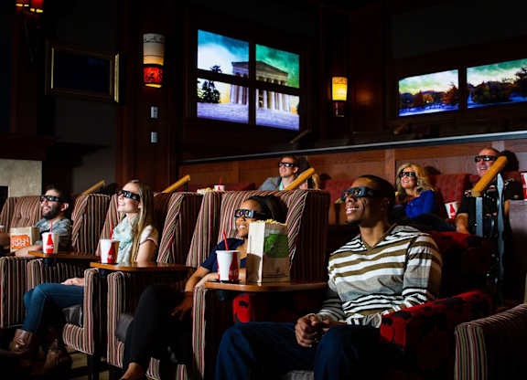 People watching movies in a cinema hall. at Residences at Prairiefire Apartment Homes, Kansas