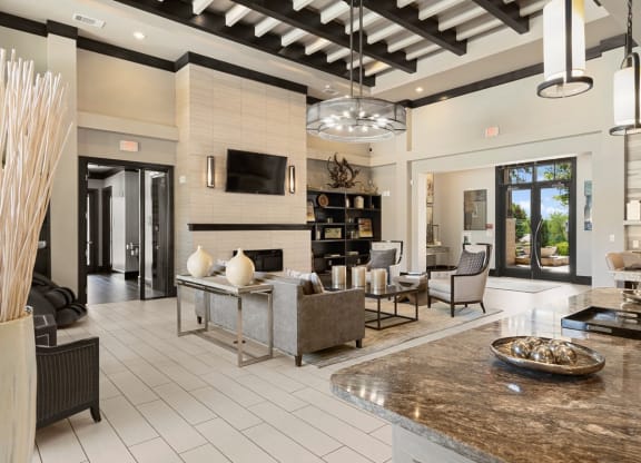 a large living room with a fireplace and a table