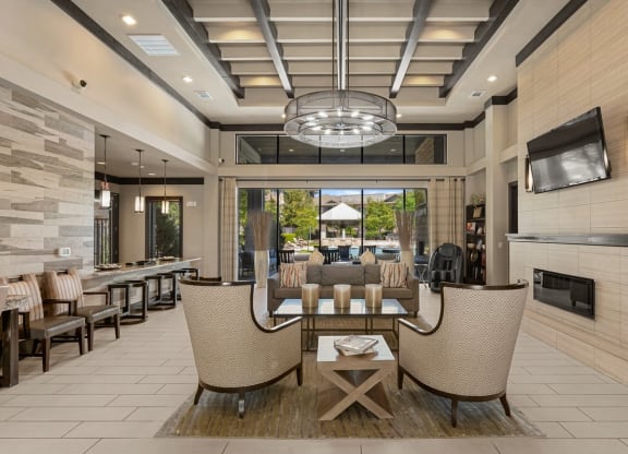 a living room with a table and chairs and a fireplace