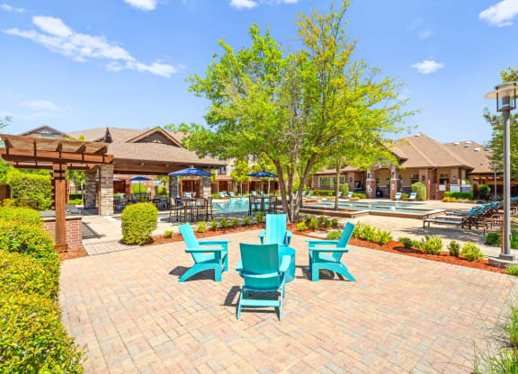 the preserve at ballantyne commons courtyard with blue chairs and trees