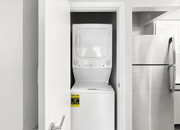white stackable washer and dryer