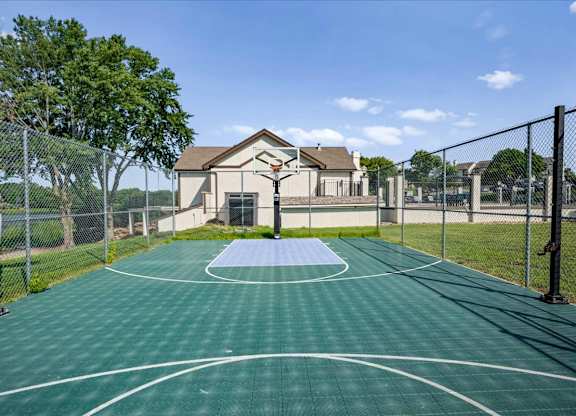 Basketball court located adjacent to the community pool area and overlooking the lake at Millcreek Woods.