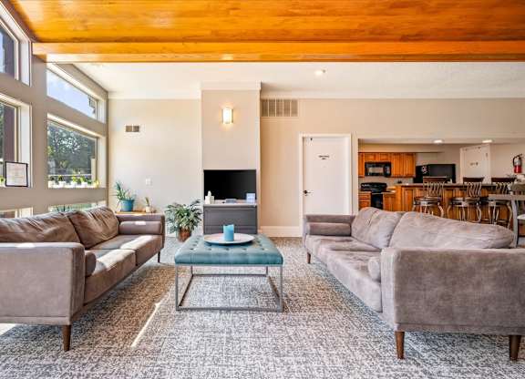 Resident lounge with comfortable seating and access to clubhouse amenities.