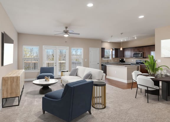 a living room and kitchen with a couch and chairs