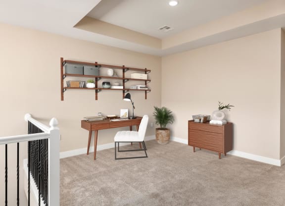 the landing of a home office with a desk and a chair