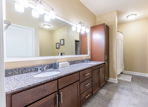 Bathroom With Vanity Lights at The Residences at Bluhawk Apartments, Overland Park