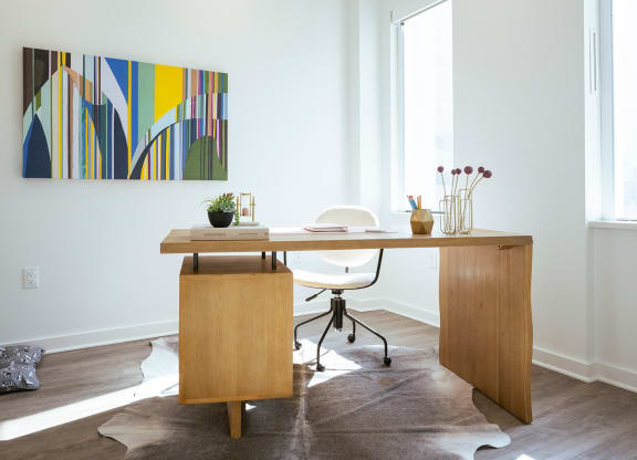 bedroom in b1 floorplan staged as an office at Sky on Main in MO