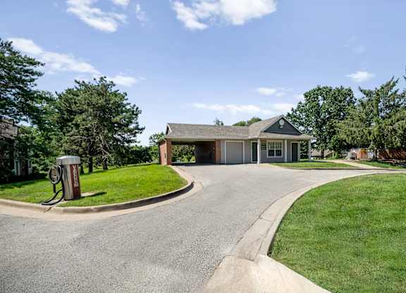 Exterior car wash station with vacuum and hose at Stonebriar Apartments in Overland Park, KS