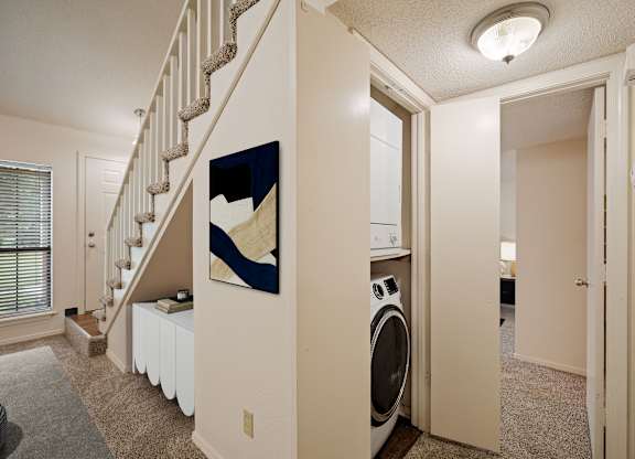 A laundry room with a washer and dryer in it.