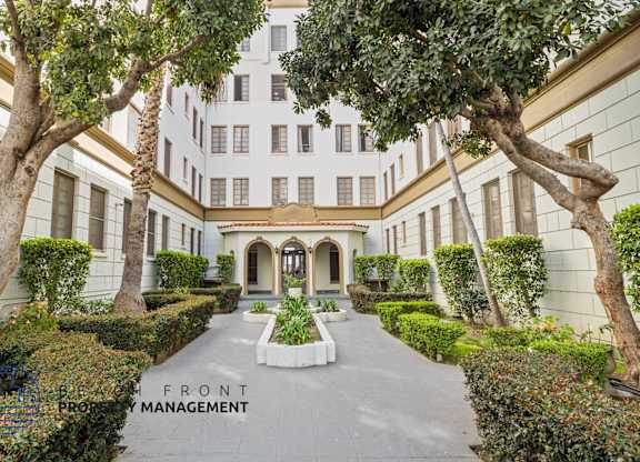 A building with a sign that says Front Management.