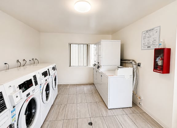 A laundry room with a washer and dryer.