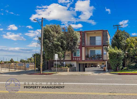 A two-story building with a balcony is located on Beach Front property.