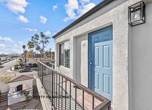 A blue door is on the front of a house.