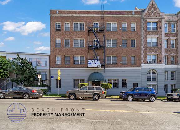 A building with the words Beach Front Property Management on the bottom left corner.