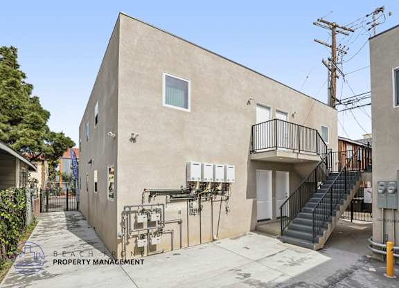A building with a staircase leading to the second floor.
