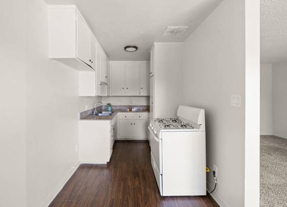 A small white laundry room with a washer and dryer.