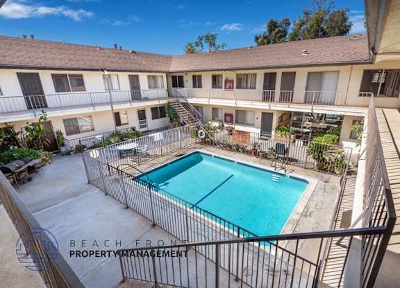 a view of the pool of a building with a swimming pool