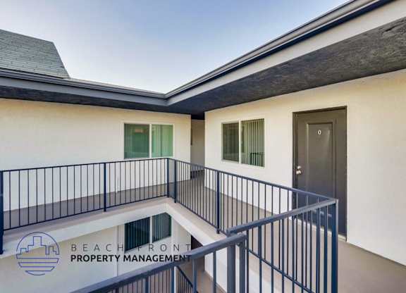 a view of a balcony of a building with a door