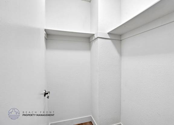 A white bathroom with a toilet and a sink.