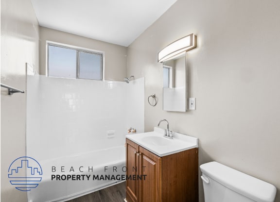 an image of a bathroom with a toilet sink and shower