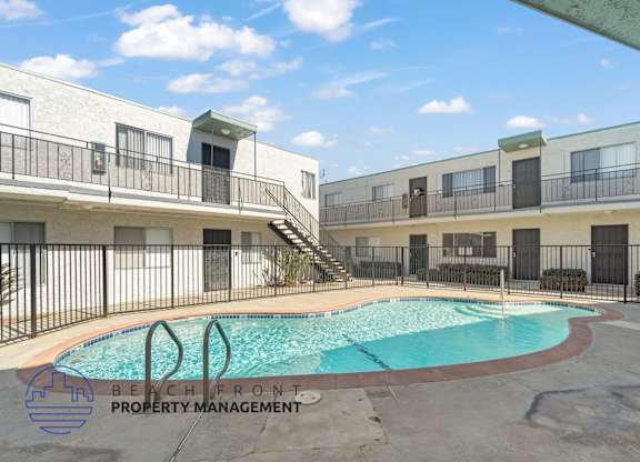 A pool with a logo that says Beach Front Property Management.