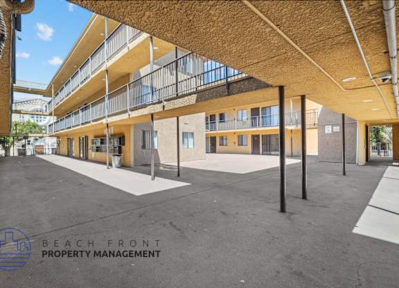 a view of the building from the outside of the beach front property management