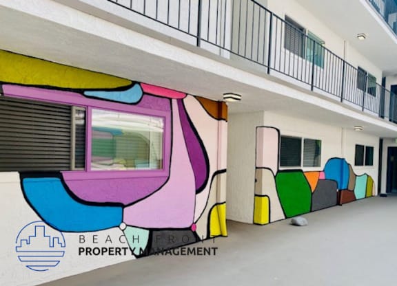 a mural of a train on the side of a building