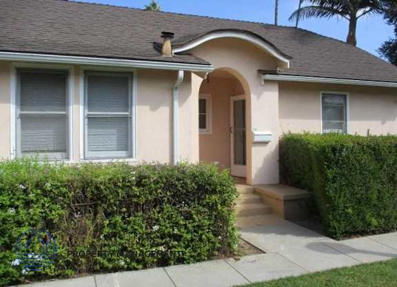 A house with a brown roof and a brown door.