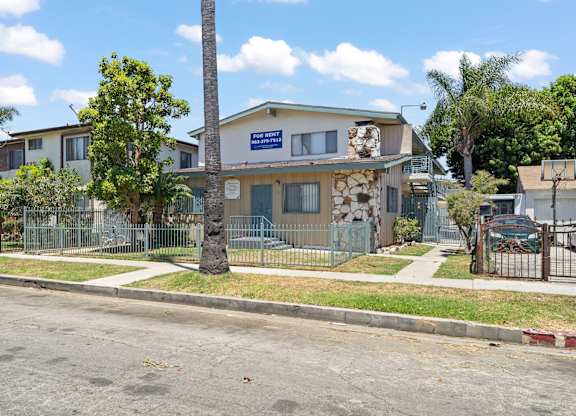 A house with a blue sign on the front.