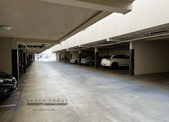 an empty parking garage at the beachfront property management building