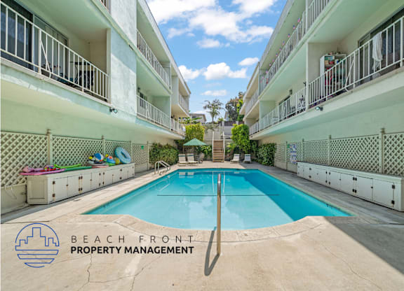 an image of a large swimming pool inbetween two buildings