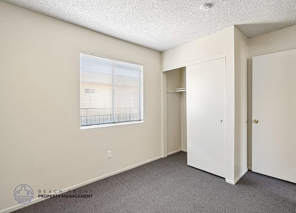 A room with a window and a door is shown.